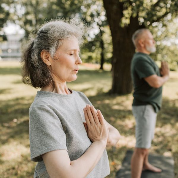 Person meditating in a calm and serene environment.